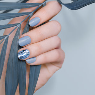 Blue manicure with metallic nail art accent