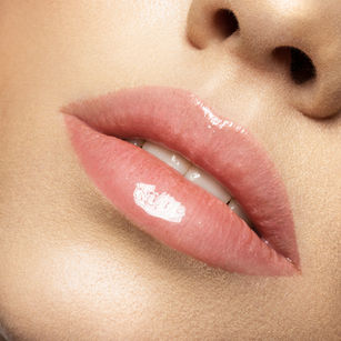 Close-up of glossy cosmetic lip tint