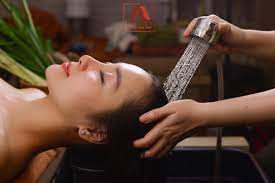 Client receiving a healthy hair wash and scalp treatment