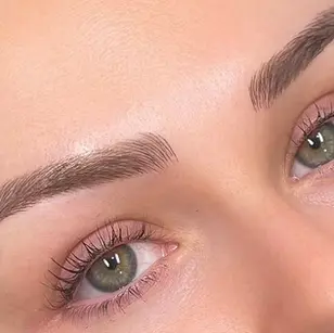 Close-up of shaped and lifted eyebrows