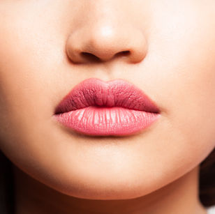 Close-up of soft pink cosmetic lip tint
