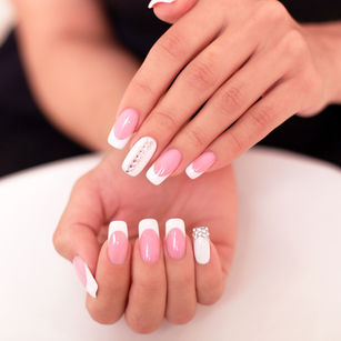 Pink and white manicure with delicate nail details