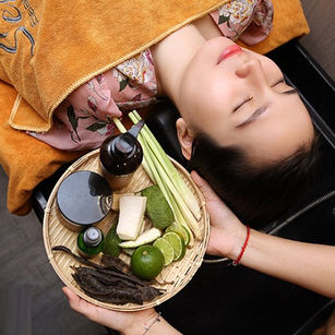 Client relaxing during a healthy hair wash treatment