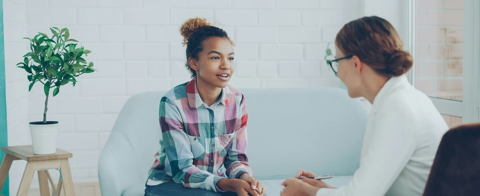 Client discussing her care with a professional consultant